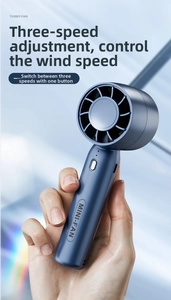 Detail of metallic blue handheld turbo fan with three-speed adjustment and power button