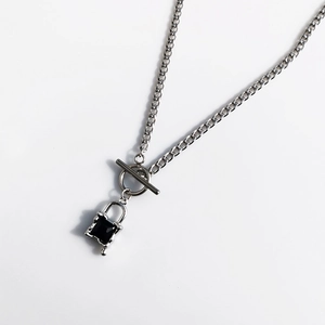Silver Cuban chain necklace with OT clasp and black gemstone lock pendant with tassels