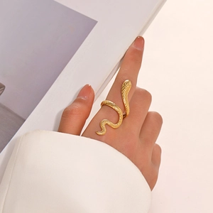 Vintage gold snake ring in stainless steel with detailed scales on model finger