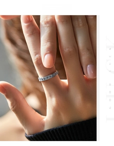 Close-up of S925 sterling silver band ring with sparkling light blue pave-set stones