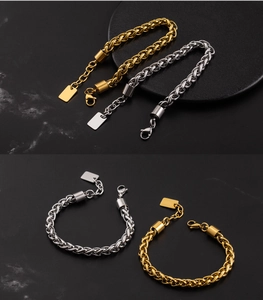 Detail of gold and silver basket weave chain bracelets with lobster clasp and tag