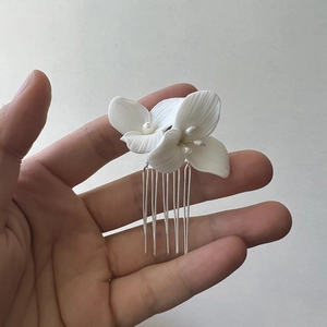 White ceramic flower bridal hair comb with freshwater pearls on silver base