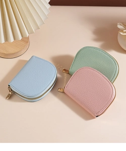 Detailed view of semi-circular lychee grain leather card holders in pastel colors