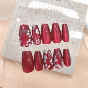 Mid-length ballet cat eye press-on nails in burgundy with butterfly and flower art