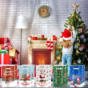 Detailed view of assorted Christmas gift bags featuring festive Santa and snowman patterns