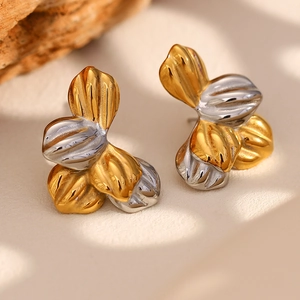 Two-tone stainless steel leaf earrings in gold and silver finish with textured patterns