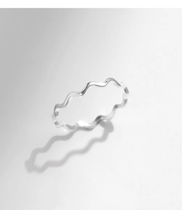Artistic close-up of S925 sterling silver minimalist wave ring with elegant shadow effect