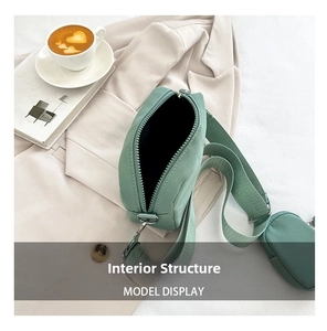 Detailed interior of mint green crossbody bag showing large capacity and inner lining