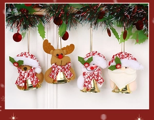 Close-up of four Christmas plush ornaments with reindeer and Santa under green vines
