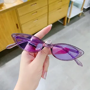 Retro purple cat-eye sunglasses with translucent frames and dark tinted UV lenses