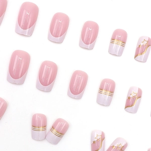 Minimalist white French press-on nails with metallic gold star and moon line patterns