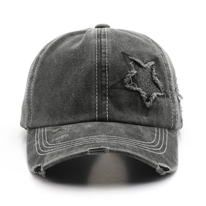 Vintage washed charcoal gray denim baseball cap with distressed star patch design
