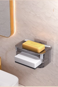 Detail of wall-mounted double-layer soap dish with draining function in dark grey acrylic