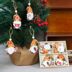 Set of 12 festive wooden gnome Christmas tree ornaments with hanging strings in a gift box