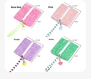 Mini felt coin purses in vibrant colors with heart charm and wrist strap detail