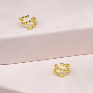 Minimalist 18k gold plated star ear cuff with zircon stones on pink geometric steps