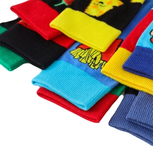 Detail of colorful knitted cotton socks featuring cartoon fries and plant patterns