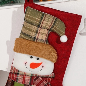 Red Christmas stocking with snowman design and plaid accents for holiday gift bag decor
