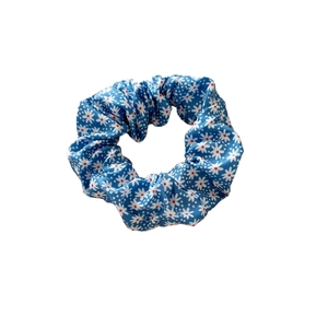 Blue floral scrunchie with daisy pattern for hair buns and ponytail styling