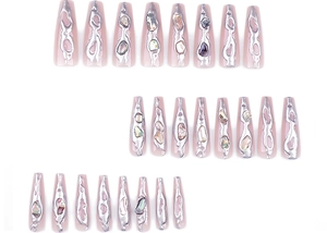 Macro view of long ballerina fake nails with 3D silver lava texture and shell inlay