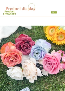 Detail showing various colors of silk rose hair clips with black plastic shark claw grips