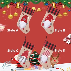 Detail showing four styles of Christmas stockings with gnome plush and plaid patterns