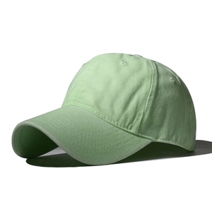 Detail shot of the mint green cotton baseball cap showing stitch lines and air vents