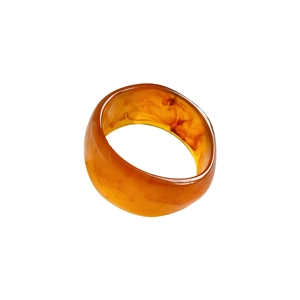 Minimalist geometric resin bangle with amber marble texture in translucent orange design