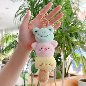 Macro shot of plush keychain with frog, pig and chick characters in a stack design