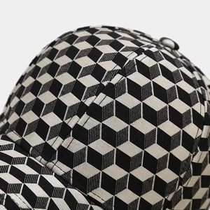Detailed close-up of 3D geometric cube pattern on premium textured baseball cap