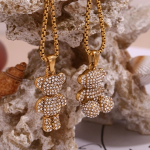 Detailed macro view of 18K gold plated bear pendant with sparkling pavé rhinestones