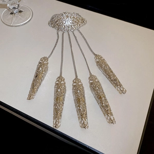 Detailed view of silver hollow flower finger armor set with intricate metal chains