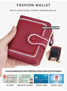 Detail view of red leather wallet with accordion card slots and zipper closure
