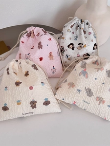 Cute seersucker drawstring pouches with cartoon prints for cosmetic storage