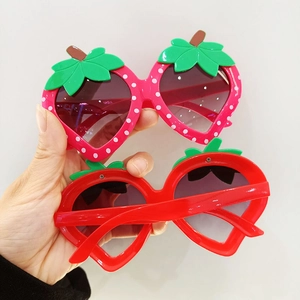 Funny strawberry shaped sunglasses for kids with cute green leaf decor and pink polka dots