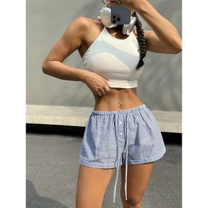 Women's summer set with white ribbed crop top and blue striped drawstring shorts