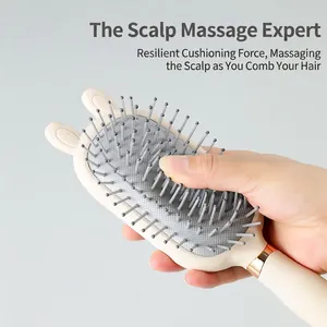 Portable bunny ear air cushion hairbrush with scalp massage bristles and mirrored finish