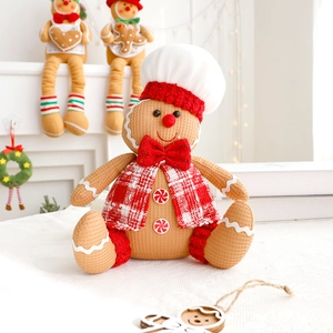 Detailed view of gingerbread plush toy with waffle texture and red plaid vest