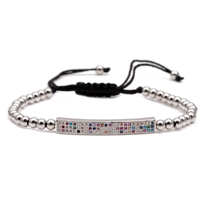 Handmade woven bracelet featuring silver copper beads and a colorful micro-pave charm