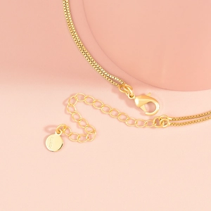 Double-layered gold beaded box chain necklace with lobster clasp and extension