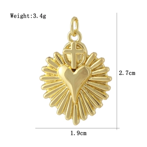 Detailed view of 18K gold heart pendant with cross and dimensions 2.7cm x 1.9cm