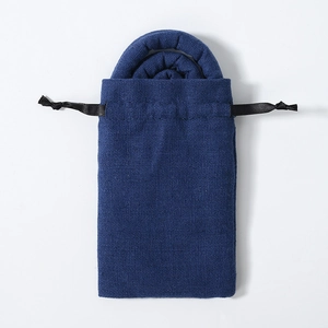 Close-up of blue linen fabric drawstring pouch for ethnic style bendable hair ties