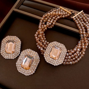Luxurious multi-layer beaded necklace and earring set with amber crystal and rhinestones