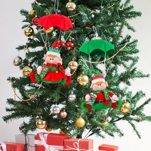 Hanging Christmas parachute elf ornaments with festive red and green fabric textures