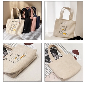 Detail of corduroy tote bag featuring bear embroidery and multiple color options