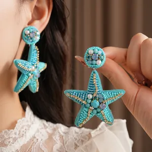 Luxurious ocean-style starfish earrings featuring cyan beads and artificial pearls