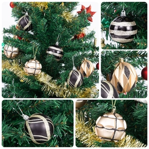 Detail of 6cm black and gold Christmas balls with various textures and glitter finish