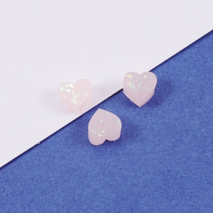 Set of three pink heart-shaped resin charms with glitter for DIY jewelry making