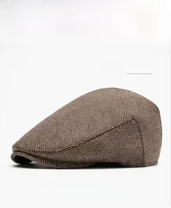 Side view of light brown herringbone flat cap showing classic wool blend fabric texture