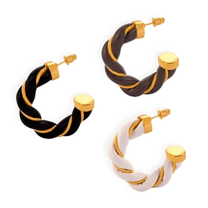 British style twisted C-shaped earrings in gold-plated metal and premium leather